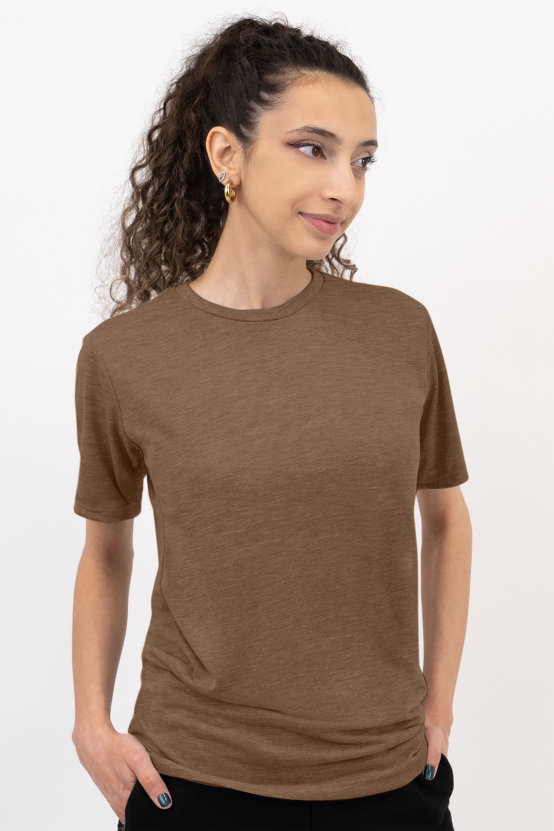 Woman wearing a brown t-shirt against a white background