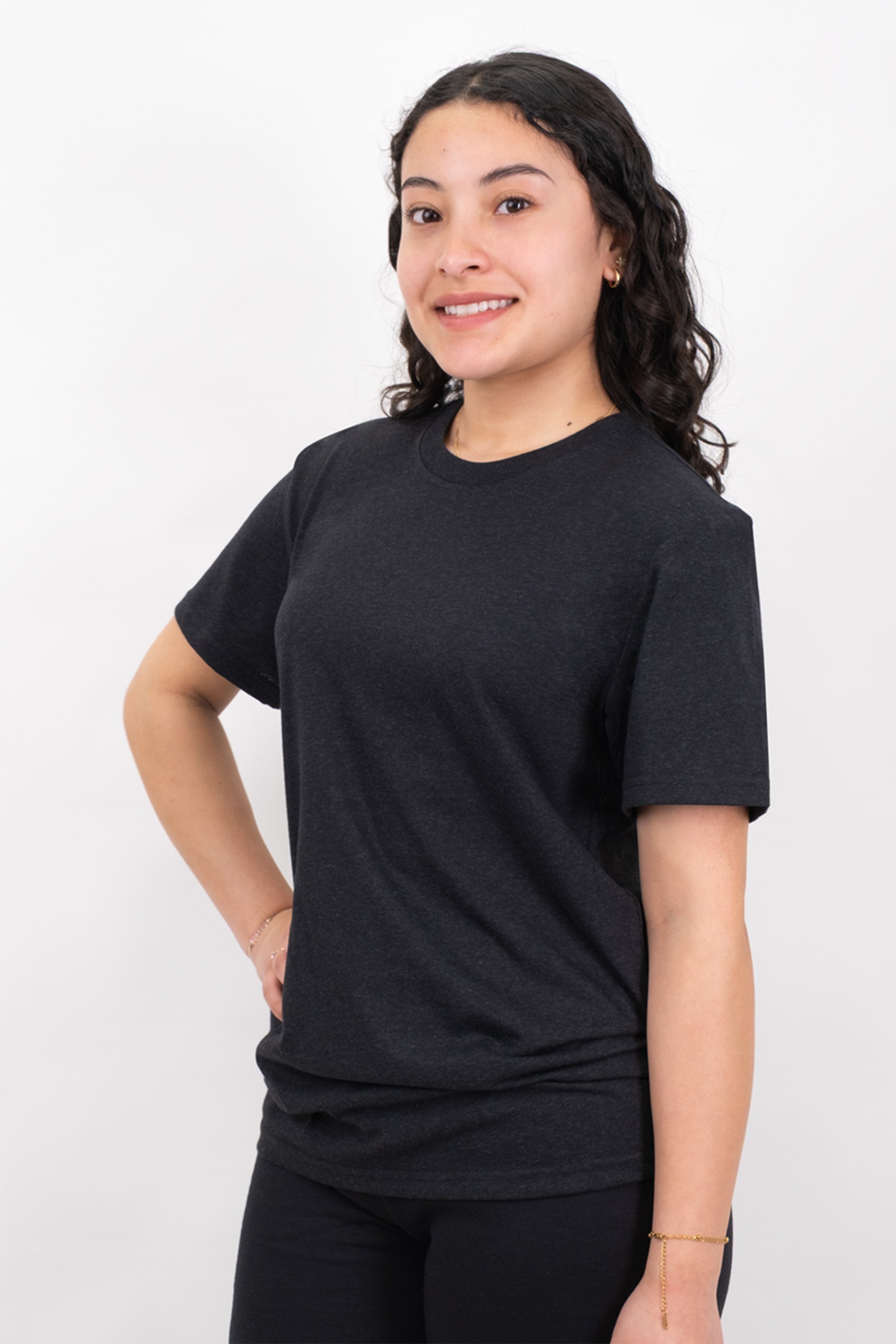 Person wearing a black t-shirt against a white background