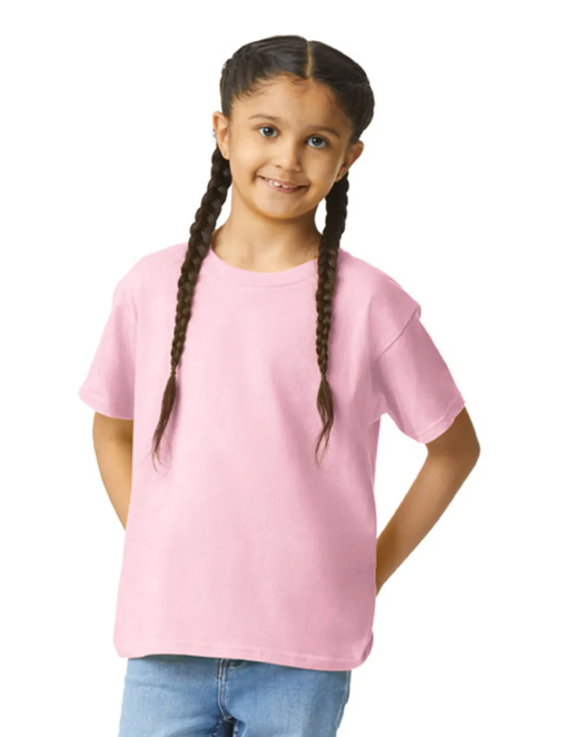 Young girl wearing a pink t-shirt on a white background