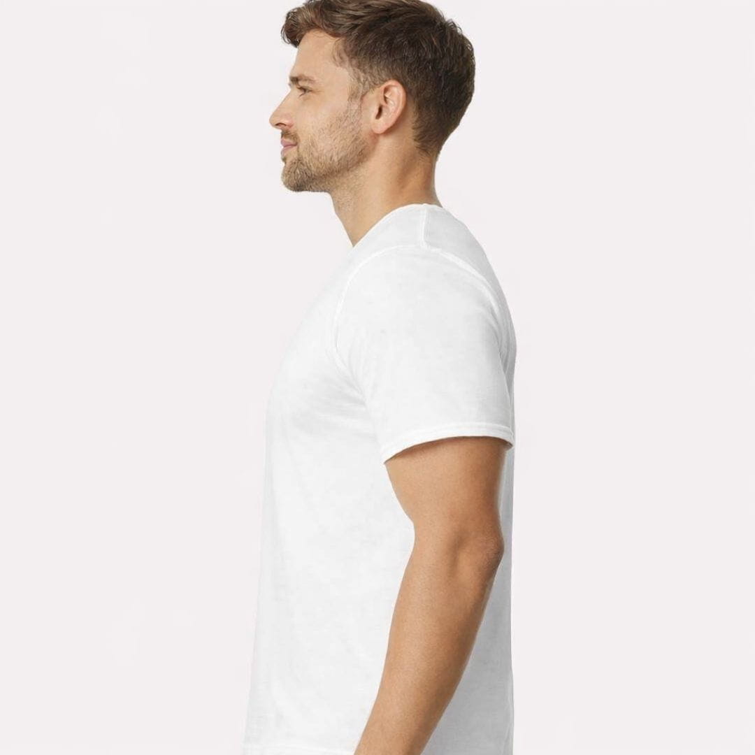 Man wearing a plain white t-shirt on a light gray background