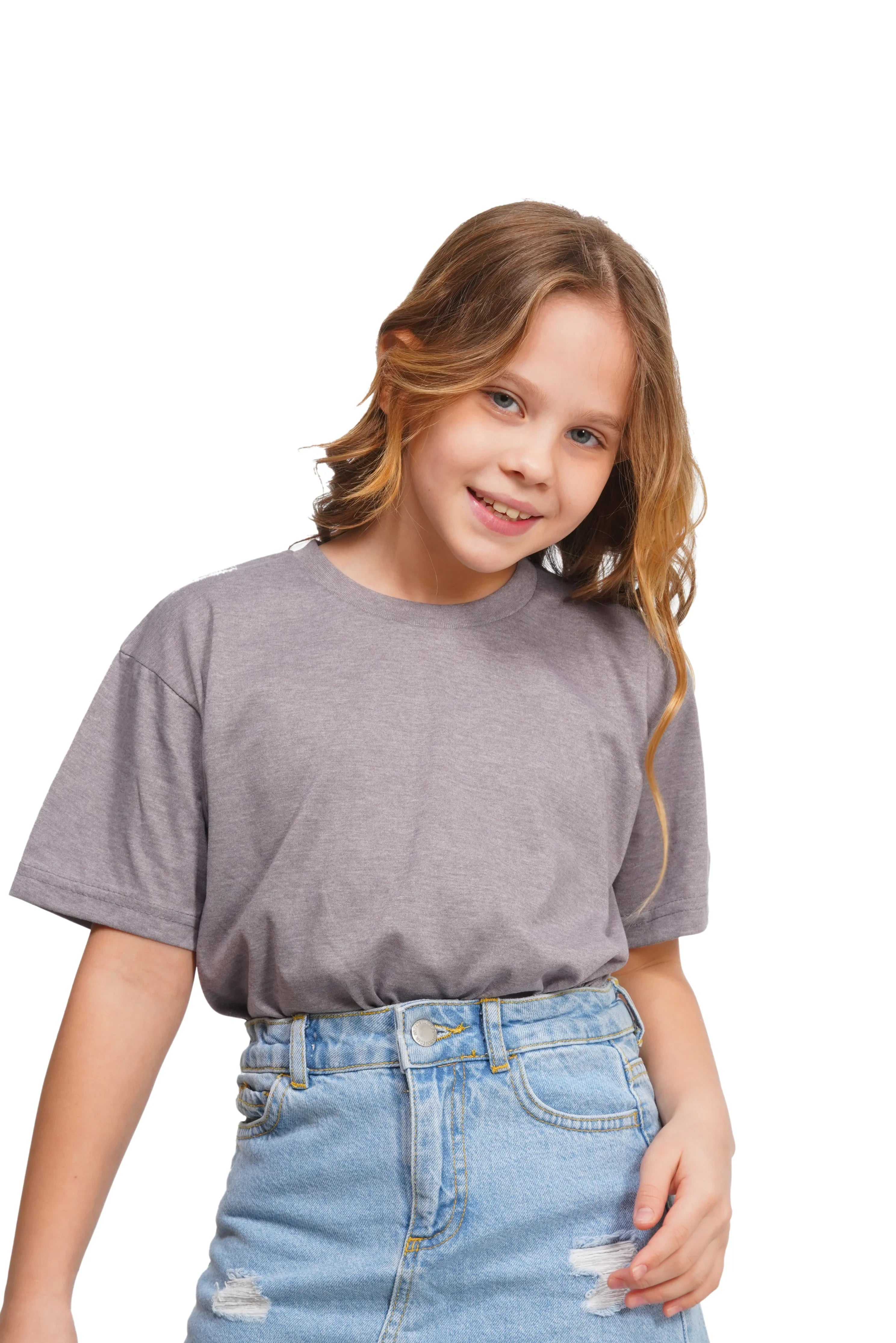 Young girl wearing a gray t-shirt and blue jeans on a white background