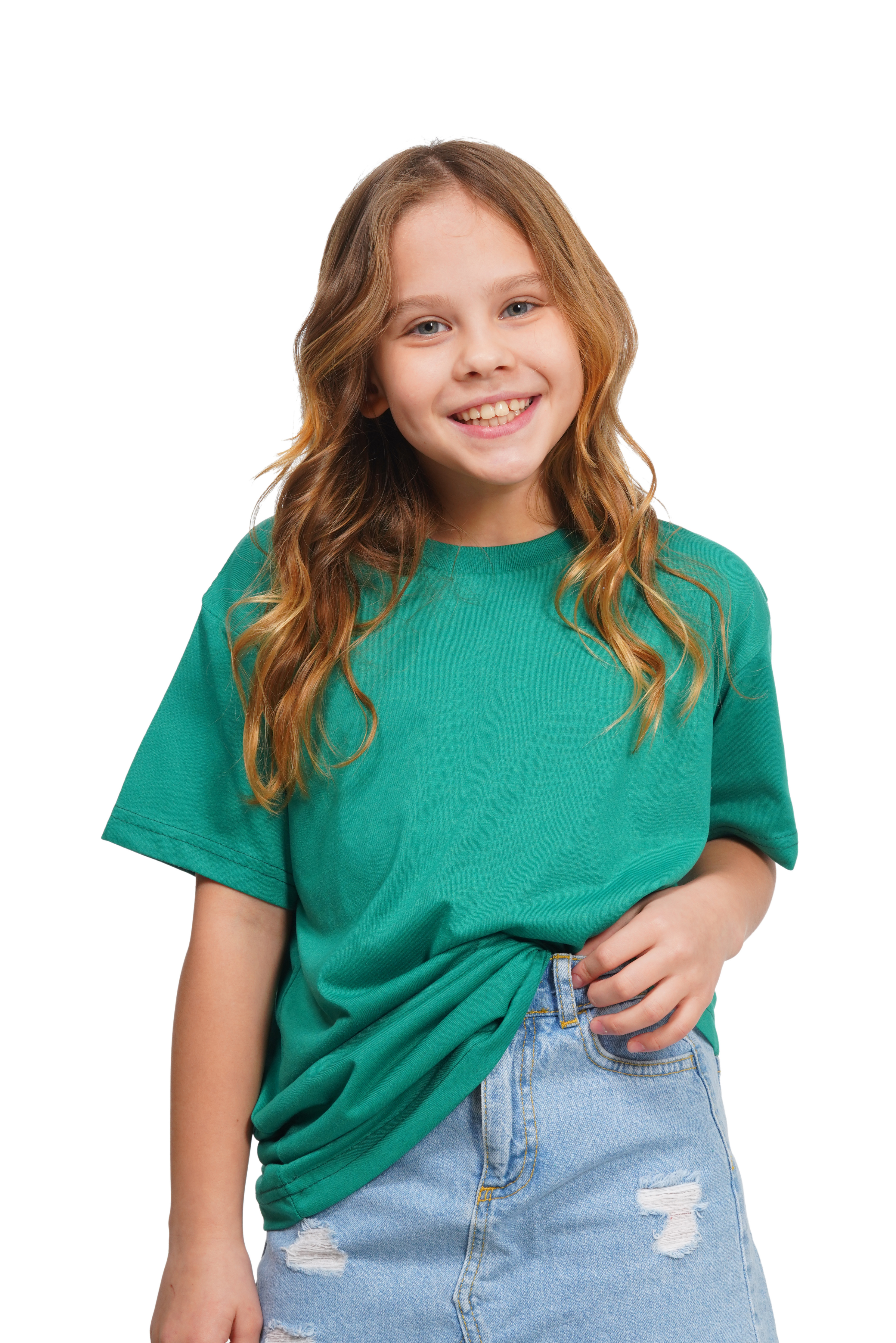 Young girl wearing a green t-shirt and blue jeans on a white background
