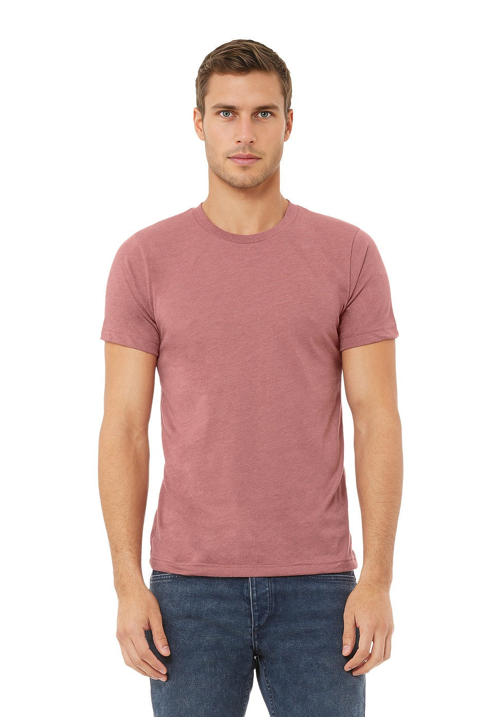 Man wearing a pink t-shirt and blue jeans on a white background