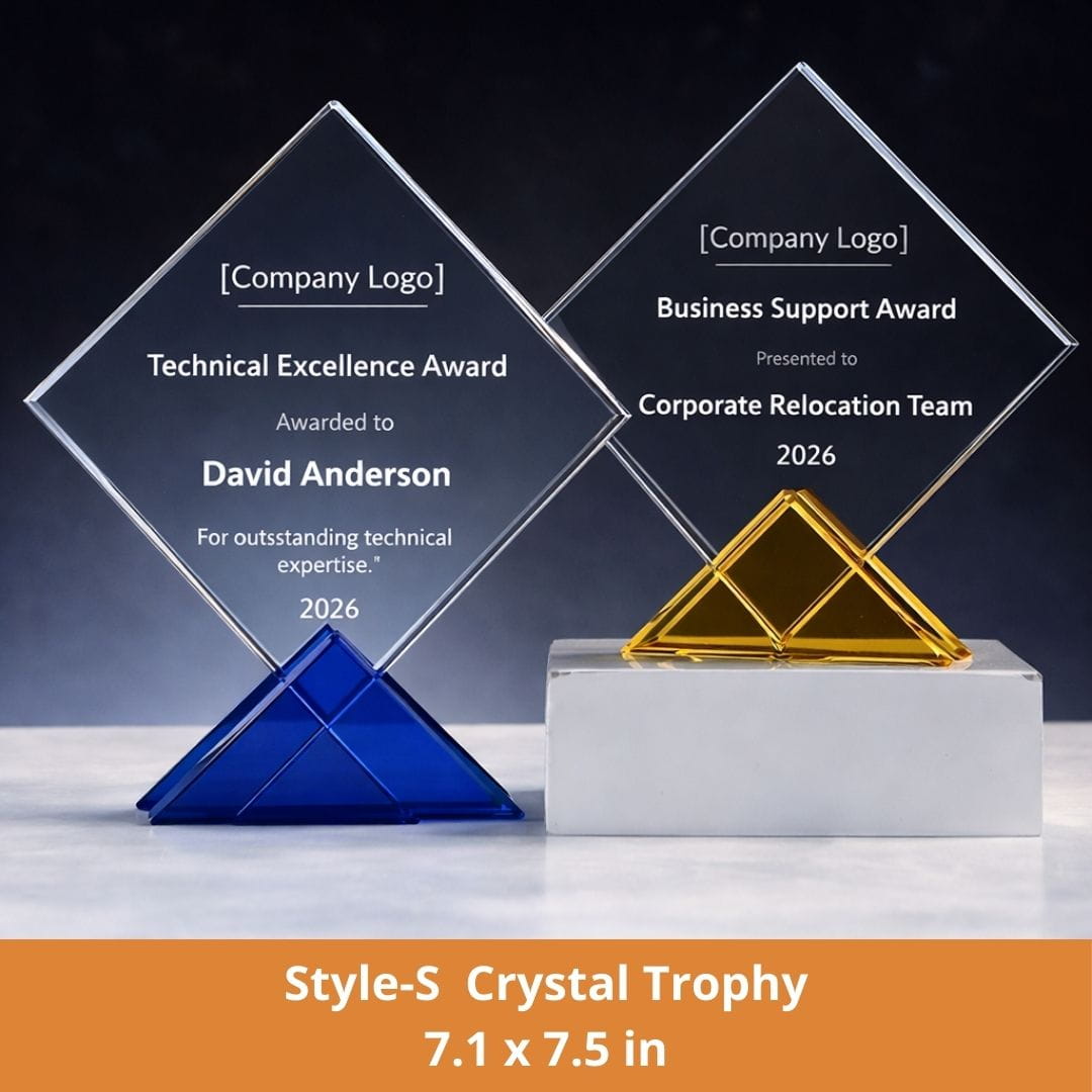 Two crystal trophies with engraved text on a dark background