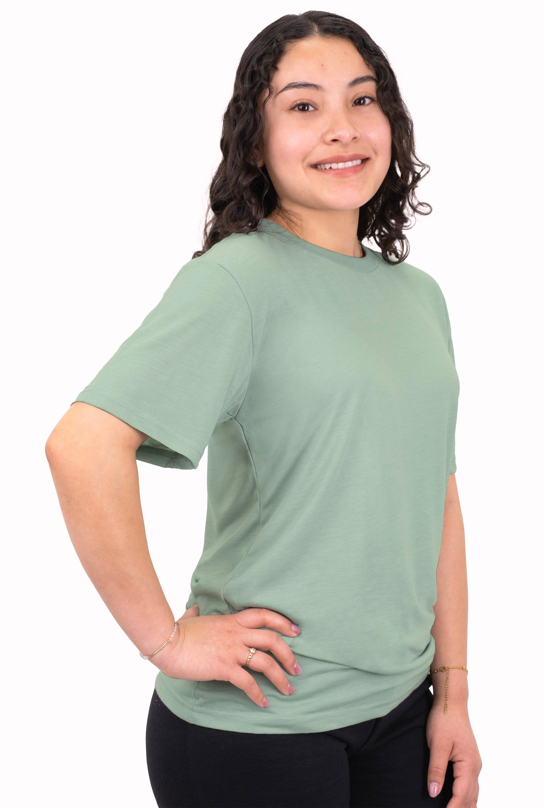 Person wearing a light green t-shirt on a white background