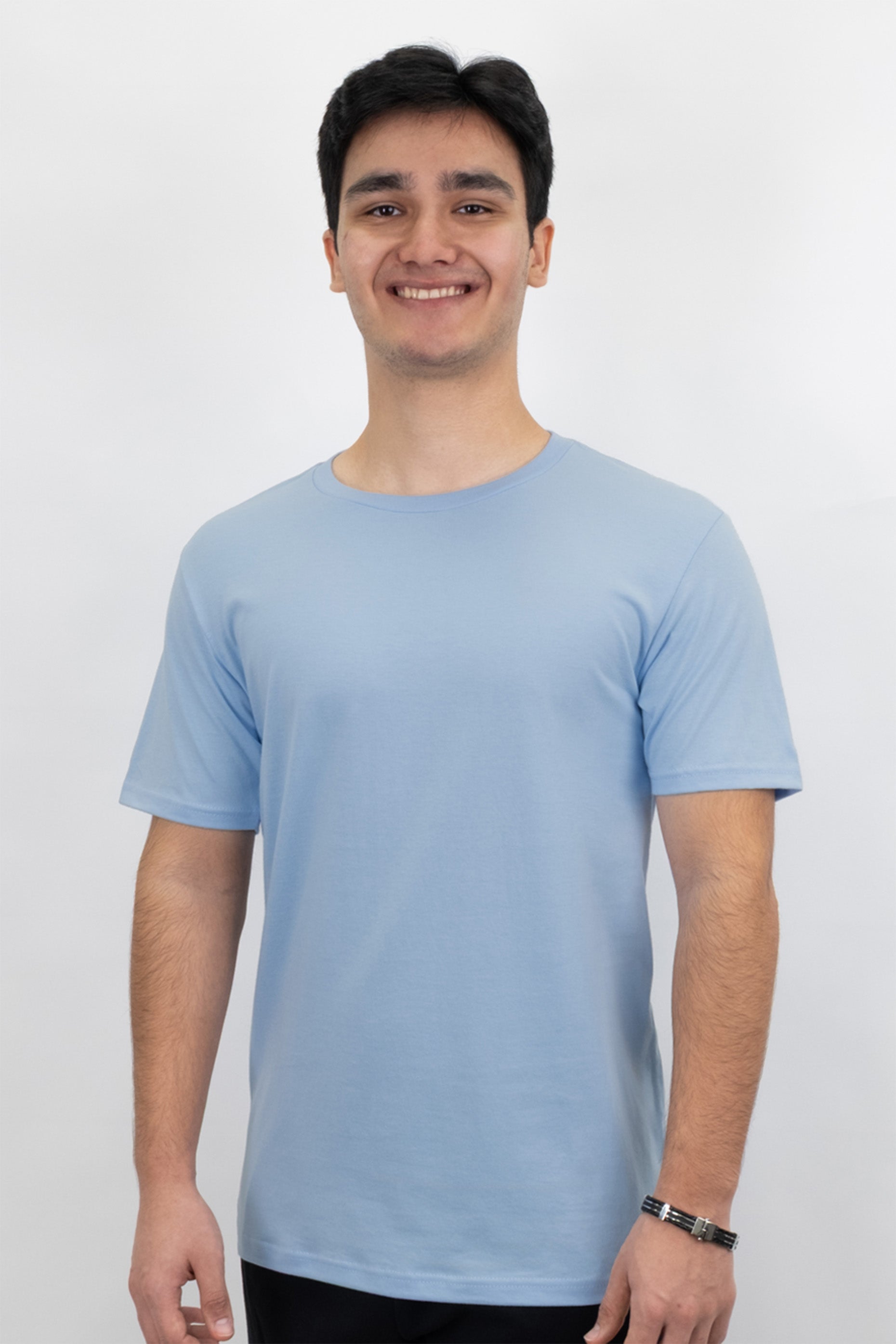 Person wearing a light blue t-shirt against a white background