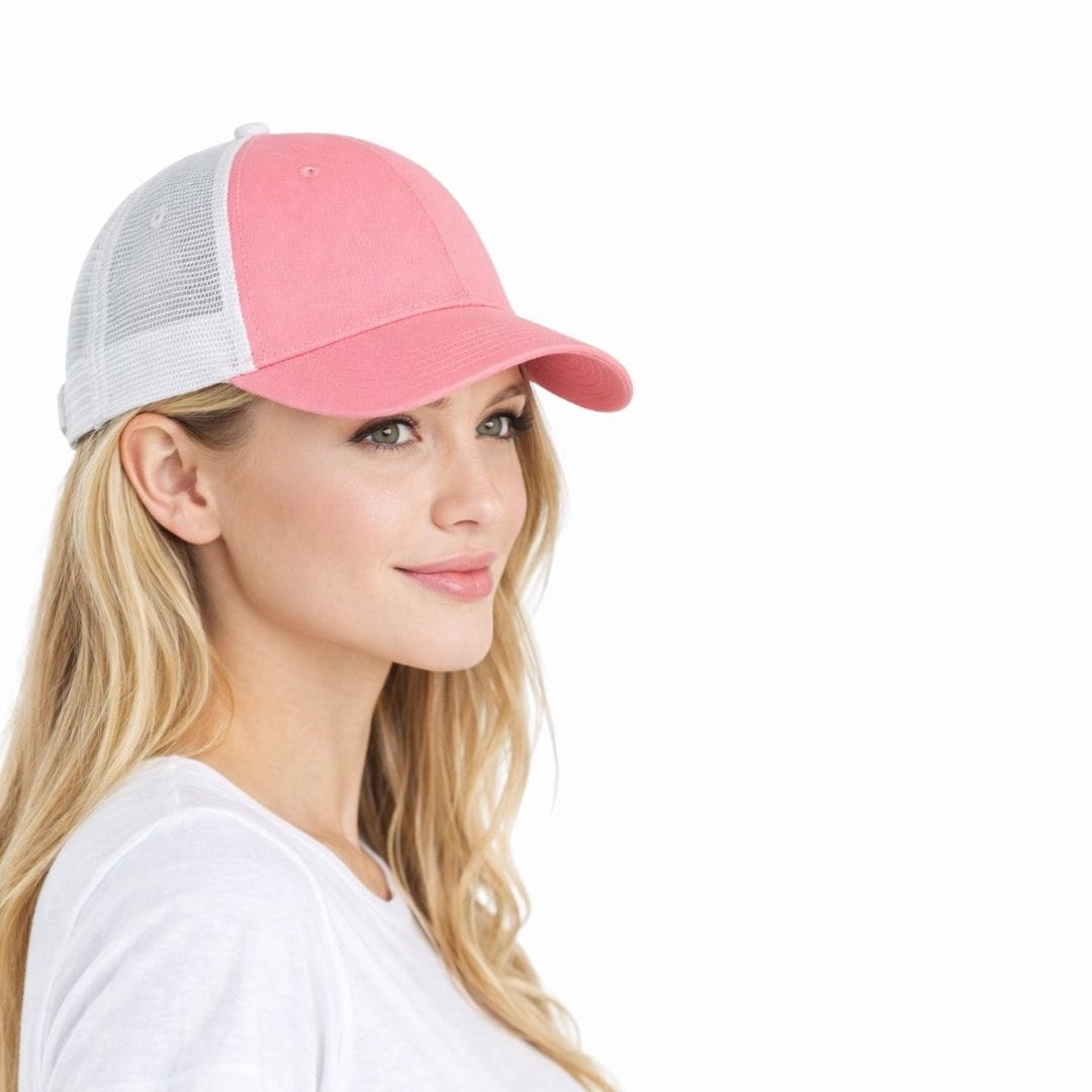 Woman wearing a pink and gray cap on a white background