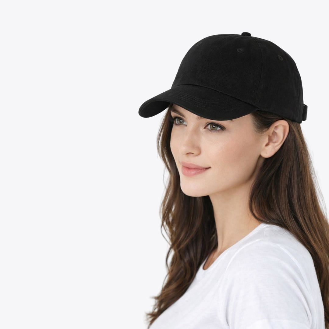 Woman wearing a black baseball cap on a white background