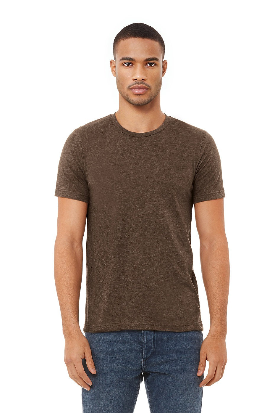 Man wearing a brown t-shirt and blue jeans on a white background