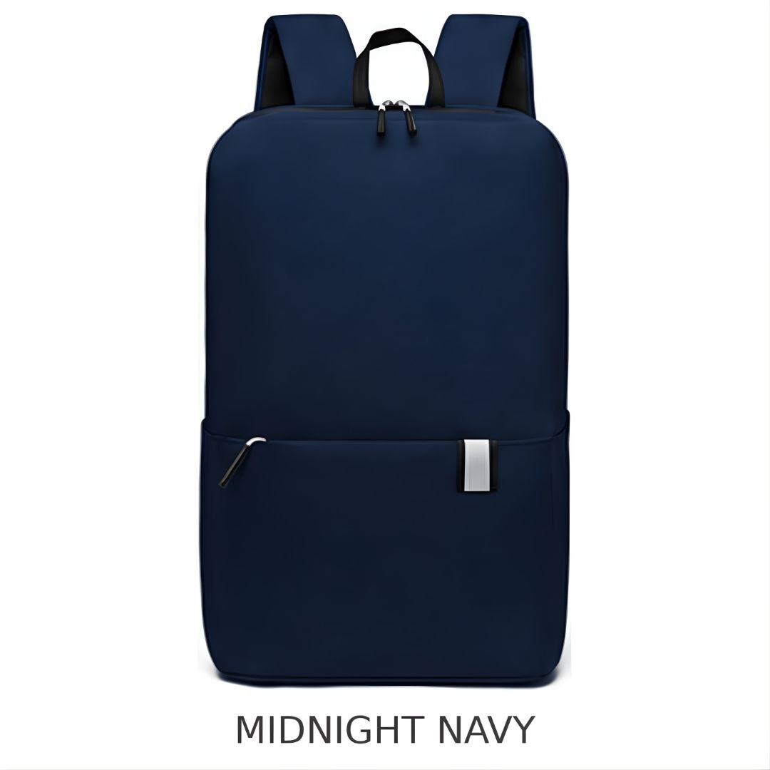 A navy blue backpack shown from the front on a white background, with the text 'MIDNIGHT NAVY' underneath.