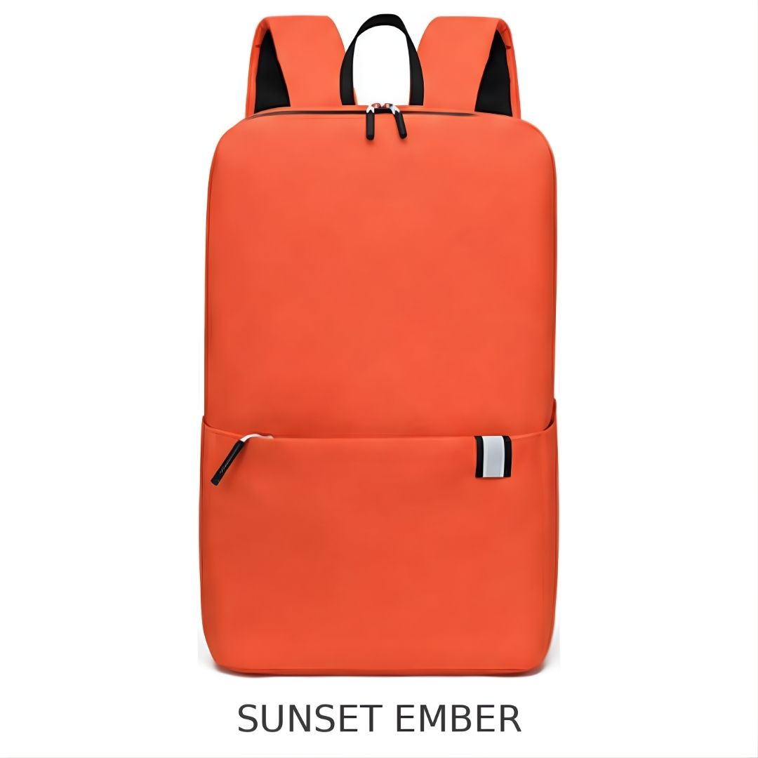 An orange backpack with a front zippered pocket, black shoulder straps, and a small white and black side tag, shown on a white background with the text 'SUNSET EMBER' underneath.