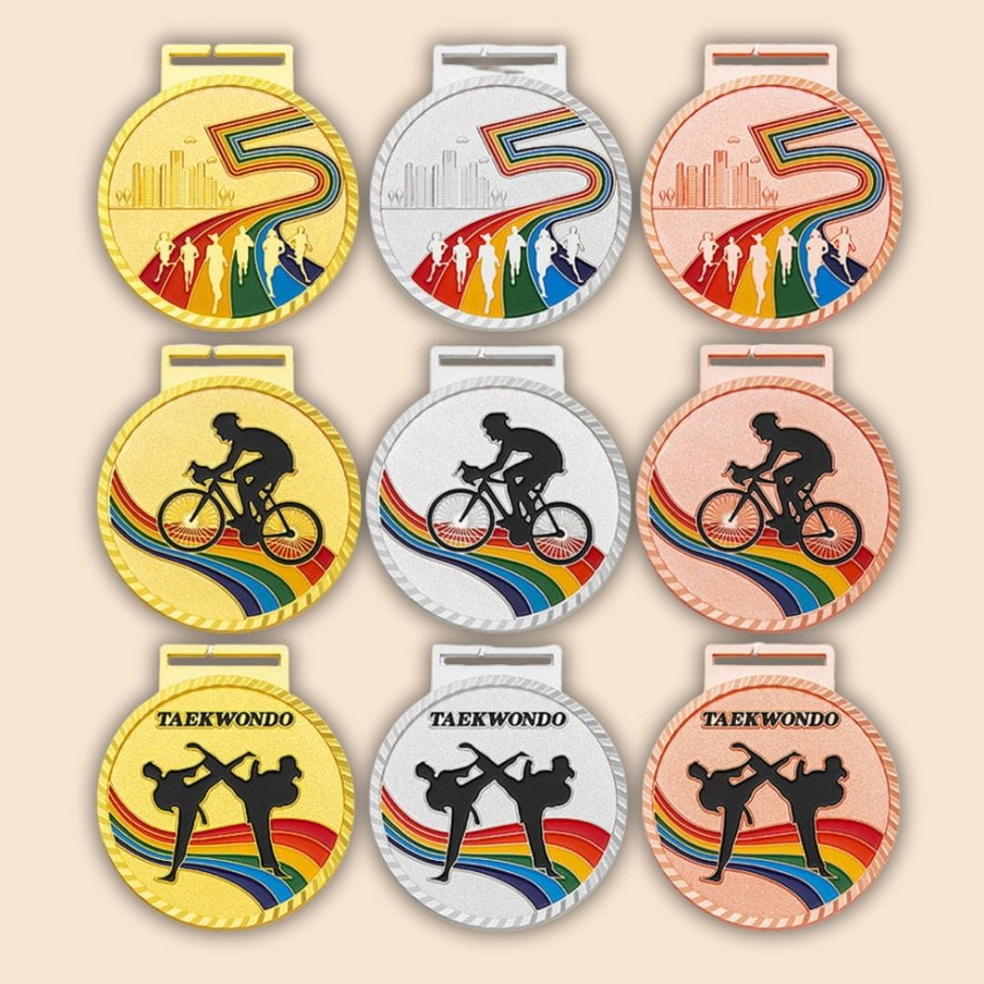 Set of six medals with different sports designs on a beige background
