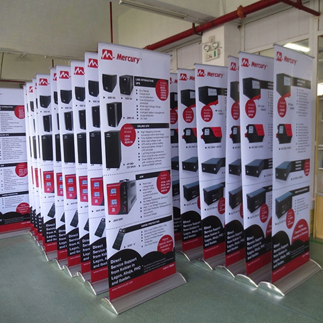 promotional banners for tech consultation, real estate, and IT solutions displayed indoors.