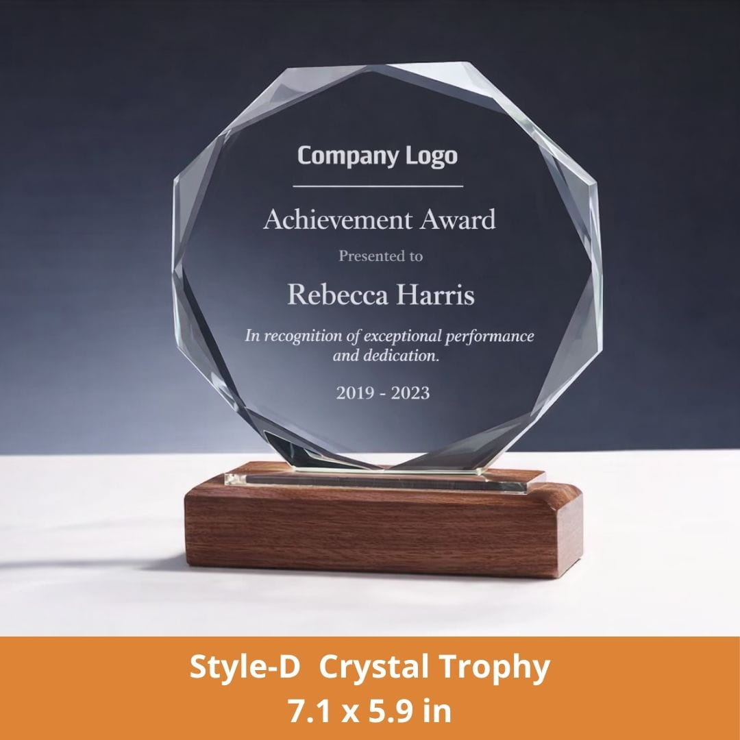 Crystal trophy with engraved text on a dark background