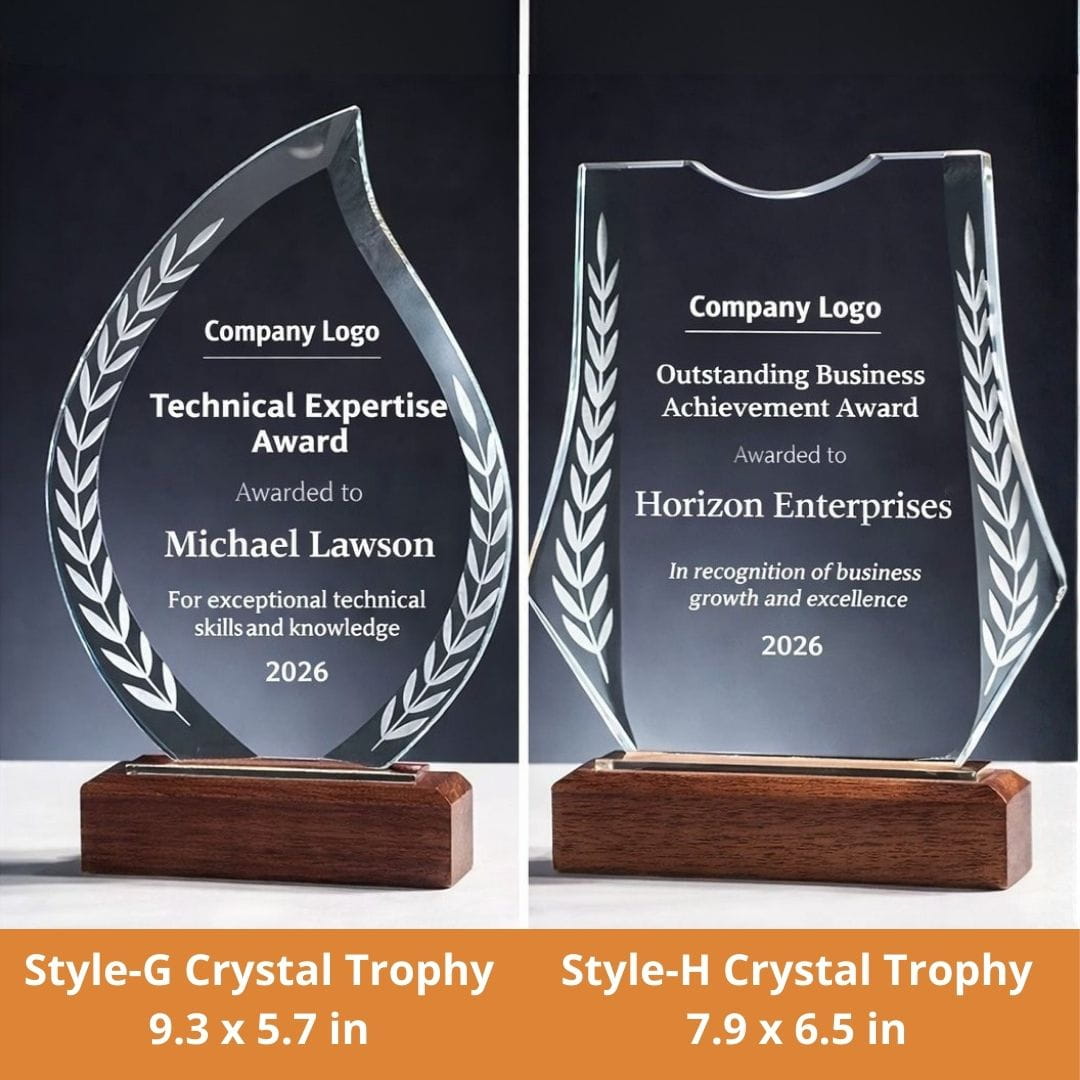 Two crystal trophies with engraved text on a dark background