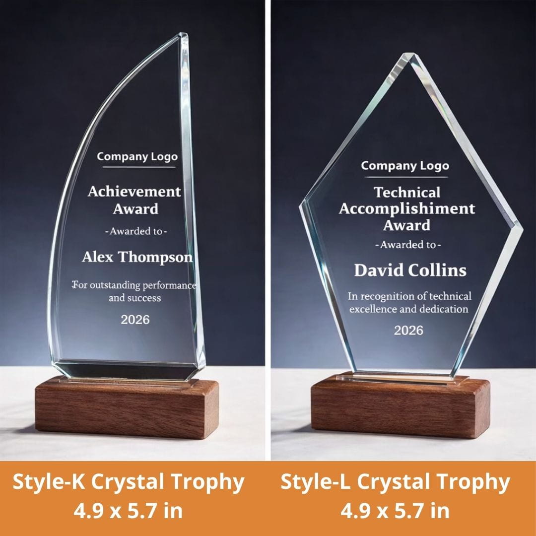Two crystal trophies with engraved text on a dark background